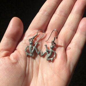Vintage pewter tone running man dangle earrings